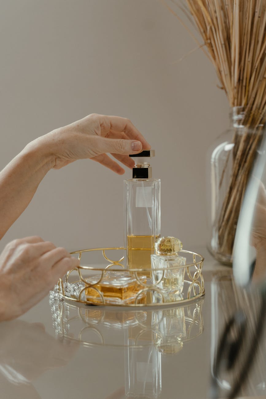 perfume bottle on golden tray