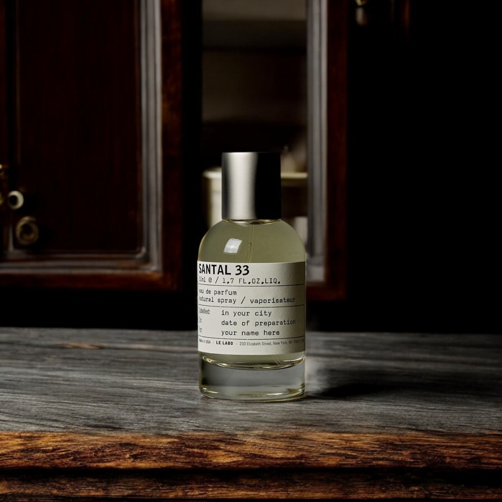 santal 33 le labo on a wooden rustic table