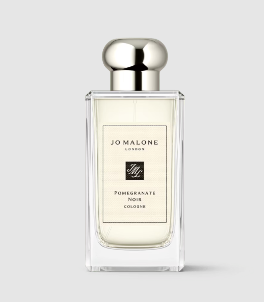 pomegranate noir cologne jo malone on neutral grey background